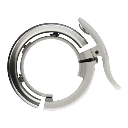 Knog Oi Prima Bike Bell – Loud 80dB Ring, Wrap-Around Design, WAVETEK Hammer, Durable Build, Easy Install – 2 Sizes to Ensure Correct Fit.