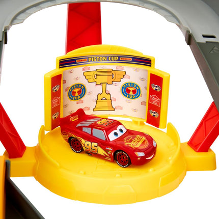Mattel Disney and Pixar Cars Track Set, Piston Cup Action Speedway Playset with 1:55 Scale Lightning McQueen Die-Cast Toy Car, HPD81