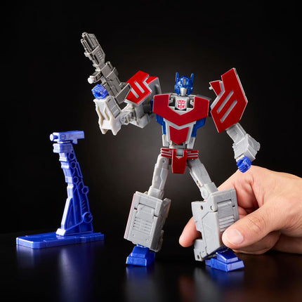 Transformers Icons Optimus Prime 6.75-Inch Voyager Class Action Figure that Converts to Autobot Logo Symbol, Display Stand, Robot Toys for Ages 8+
