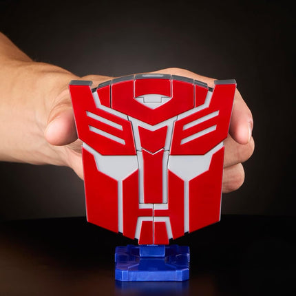 Transformers Icons Optimus Prime 6.75-Inch Voyager Class Action Figure that Converts to Autobot Logo Symbol, Display Stand, Robot Toys for Ages 8+