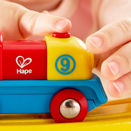 Hape Brave Little Engine | Button-Operated Multi-Coloured Train, Exceptional Battery-Powered Train, Red, Yellow + Blue Finish