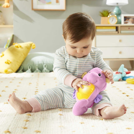 Fisher Price FISHER-PRICE Caballito de mar que brilla y calma, rosa, juguetes de peluche