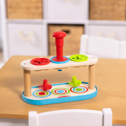 Melissa & Doug Trompos giratorios para emparejar y empujar, juguete para desarrollar la habilidad de combinar colores y la motricidad fina para niños de 2 años en adelante - Certificado FSC