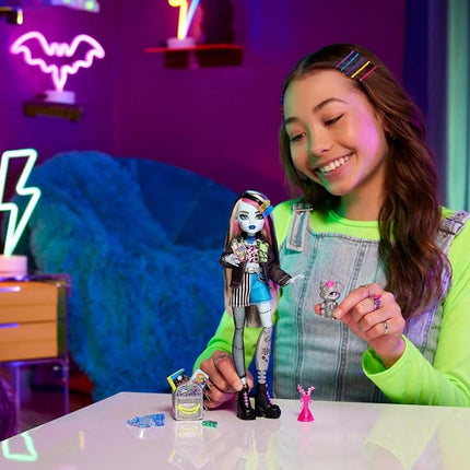 Monster High Frankie Stein Doll in Denim Jacket & Shorts, Includes Pet Dog Watzie & Accessories like a Backpack, Snack & Notebook