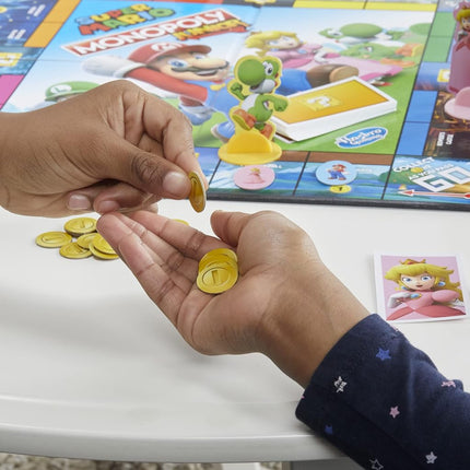 MONOPOLY Junior Super Mario Edition Board Game, Fun Kids' Game Ages 5 and Up, Explore The Mushroom Kingdom as Mario, Peach, Yoshi, or Luigi