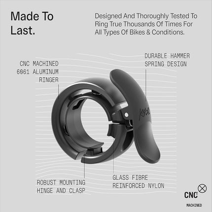 Knog Oi Prima Bike Bell – Loud 80dB Ring, Wrap-Around Design, WAVETEK Hammer, Durable Build, Easy Install – 2 Sizes to Ensure Correct Fit.