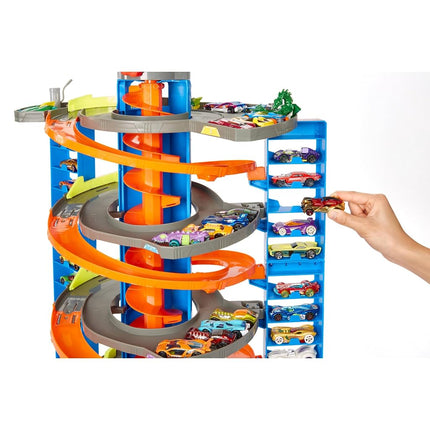 Pista de juguete Hot Wheels Mega Garaje, almacena más de 60 vehículos, incluye 1 vehículo de fundición (Mattel GTT95)