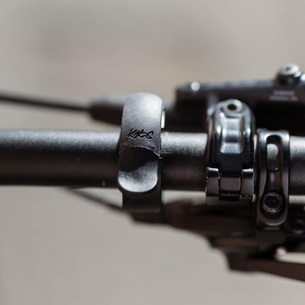 Knog Oi Prima Bike Bell – Loud 80dB Ring, Wrap-Around Design, WAVETEK Hammer, Durable Build, Easy Install – 2 Sizes to Ensure Correct Fit.
