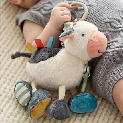 Itzy Ritzy Link & Love Toy for Stroller or Car Seat; Features Textured Ribbons, Crinkle Sounds, Clinking Rings & Silicone Teether; Designed For Ages 0 Months and Up (Cow)