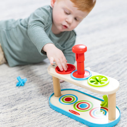 Melissa & Doug Trompos giratorios para emparejar y empujar, juguete para desarrollar la habilidad de combinar colores y la motricidad fina para niños de 2 años en adelante - Certificado FSC