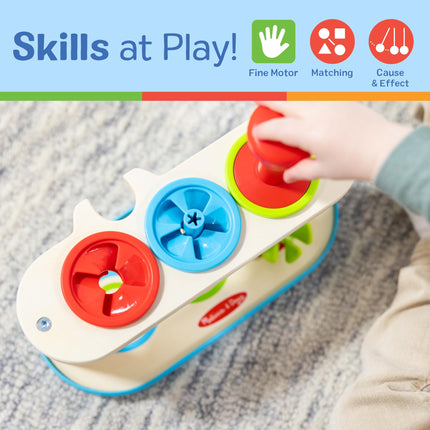 Melissa & Doug Trompos giratorios para emparejar y empujar, juguete para desarrollar la habilidad de combinar colores y la motricidad fina para niños de 2 años en adelante - Certificado FSC