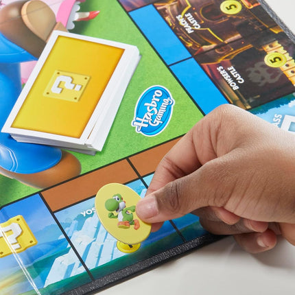 MONOPOLY Junior Super Mario Edition Board Game, Fun Kids' Game Ages 5 and Up, Explore The Mushroom Kingdom as Mario, Peach, Yoshi, or Luigi
