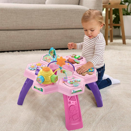 VTech Buzz and Learn activity table with seven interactive play zones, pink
