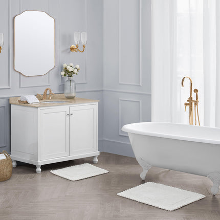 Juego de 2 alfombras de baño de algodón con volantes Laura Ashley, blancas