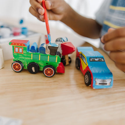 Melissa & Doug Sinoeem - Set de decoración de aviones, trenes y coches de carreras de madera DIY