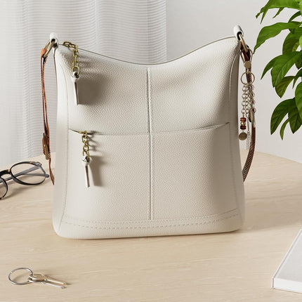 The Sak Lucia Crossbody Bag in Leather, Convertible Purse with Adjustable Strap, Stone, Medium