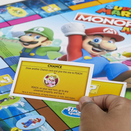 MONOPOLY Junior Super Mario Edition Board Game, Fun Kids' Game Ages 5 and Up, Explore The Mushroom Kingdom as Mario, Peach, Yoshi, or Luigi