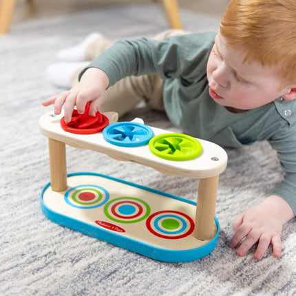 Melissa & Doug Trompos giratorios para emparejar y empujar, juguete para desarrollar la habilidad de combinar colores y la motricidad fina para niños de 2 años en adelante - Certificado FSC