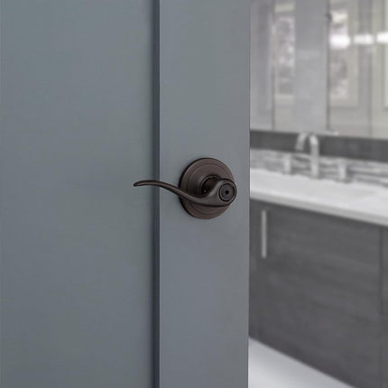 Kwikset Tustin Bed/Bath Lever in Venetian Bronze