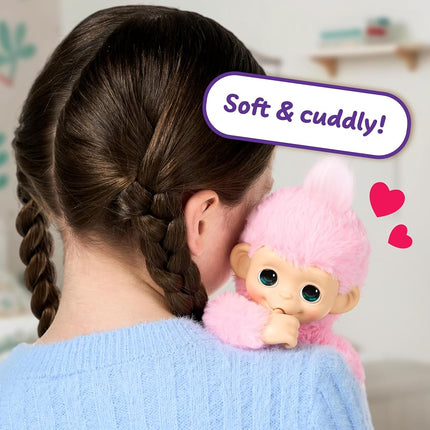 Little Live Pets Baby Monkey Minis – Luna Lemon. Interactive Pet Toy. 20+ Sounds & Reactions. Soft Pink Fur. 7.4" Tall. Feed, Nurture. React. Grippy Hands & Feet. Collect All 3