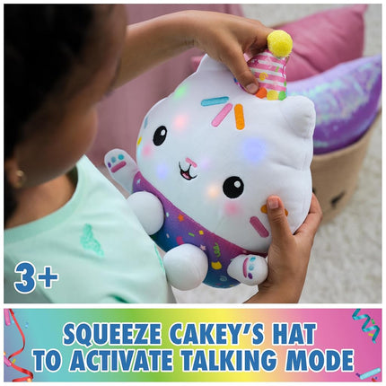 Gabby’s Dollhouse Celebrations, Sprinkle Party Cakey Cat Soft Toy, 25-Centimetre Interactive Soft Toy with Sounds, Kids’ Toys for Girls and Boys Aged 3+