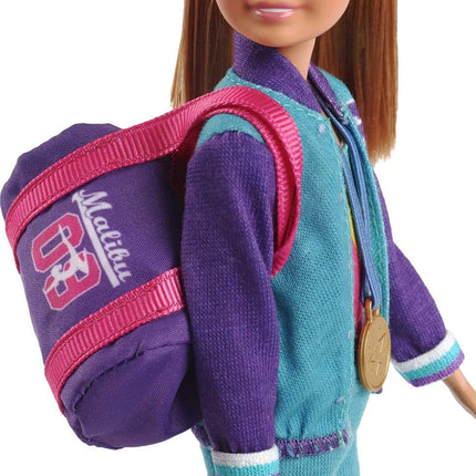 Barbie GBK59 Team Stacie Doll and Gymnastics Playset with Spinning Bar and 7 Themed Accessories, Multicoloured