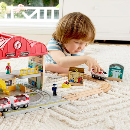 Hape Portable Train Station Set | Wooden Railway Toy with Figurines, Storage Box & Handle | Expandable, Imaginative Play & Travel-Friendly