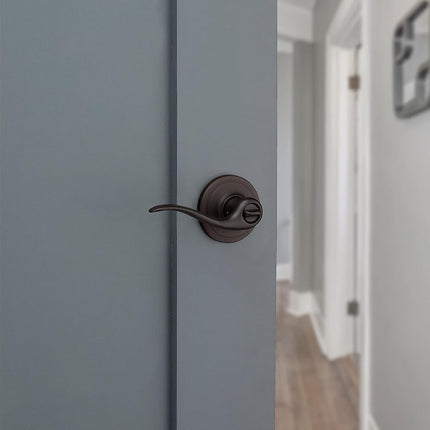 Kwikset Tustin Bed/Bath Lever in Venetian Bronze
