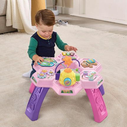 VTech Buzz and Learn activity table with seven interactive play zones, pink