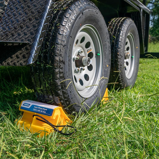 Camco Super Wheel Chock w/Rope - Large, Heavy Duty Trailer Wheel Chock Constructed of Durable Plastic - Features Rope Handle for Easy Removal - Use w/Tires Up to 29-inches – 44475