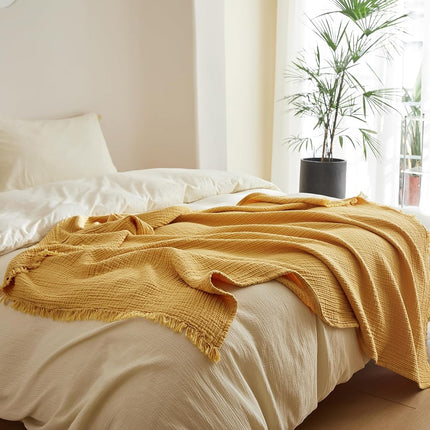 Manta Simple&Opulence de muselina de algodón de 4 capas para cama, sofá, manta de gasa tejida con borlas, suave, ligera, acogedora, prelavada, transpirable, decoración de granja para todas las estaciones (amarillo)