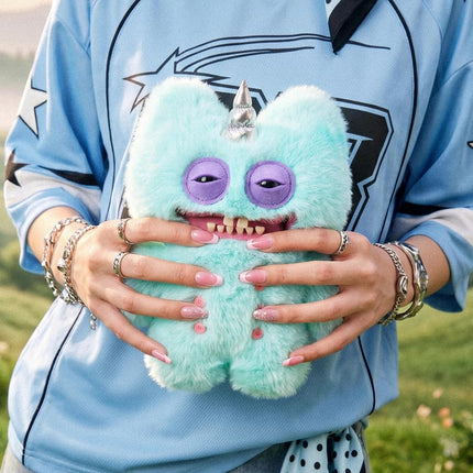 Fuggler Fugglercorns 9 Inch Plush Collectible Toy (Stinkface) by ZURU Featuring Funny Ugly Monster Unicorn Designs with Glitter Details, Human‑Like Teeth, Crooked Horns