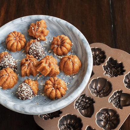 Nordic Ware Autumn Delights Cakelet Pan, 3D Cast Aluminium Bundt Tin, Bundt Cake Tin with Autumn Pattern, Premium Cake Mould Made in The USA, Colour: Bronze Transparent