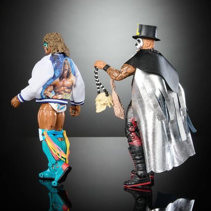 Mattel WWE Ultimate Edition Paquete de 2 figuras de acción, set coleccionable Greatest Grudges '92 con superestrellas de 6 pulgadas Ultimate Warrior y Papa Shango y accesorios