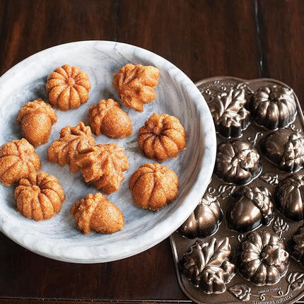 Nordic Ware Autumn Delights Cakelet Pan, 3D Cast Aluminium Bundt Tin, Bundt Cake Tin with Autumn Pattern, Premium Cake Mould Made in The USA, Colour: Bronze Transparent