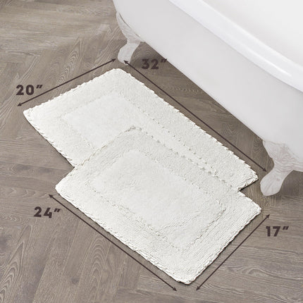 Juego de 2 alfombras de baño de algodón con volantes Laura Ashley, blancas